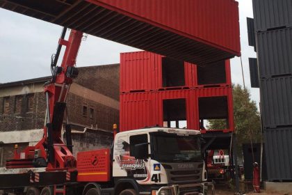container lifted by crane truck